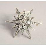 A GOOD VICTORIAN DIAMOND SET STAR BROOCH with central diamond, six medium diamonds and smaller