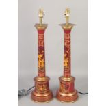 A PAIR OF RED TOLEWARE CHINESE DESIGN LAMPS. 24ins high.