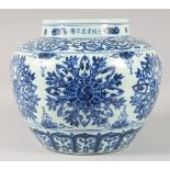 A VERY LARGE CHINESE BLUE AND WHITE PORCELAIN JAR, decorated with floral motifs. 29cm high.