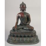 A LARGE BRONZE SEATED BUDDHA. 12ins long.