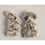 TWO NOVELTY CAST SILVER BEATRIX POTTER RABBIT BROOCHES.