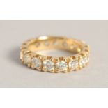A SUPERB 18CT YELLOW GOLD DIAMOND ETERNITY RING set with 4ct diamonds of twenty stones, in an