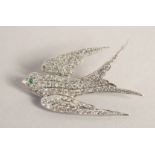 AN 18CT WHITE GOLD DIAMOND SET SWALLOW BROOCH.