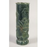 A TALL CARVED JADE BRUSH POT. 11ins high.