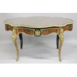A SUPERB VICTORIAN BOULLE OVAL CENTRAL TABLE with brass inlay on tortoiseshell, fitted with a long