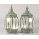 A PAIR OF BULBOUS COPPER STORM LANTERNS 18ins high.