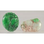 TWO CARVED JADE PENDANTS.