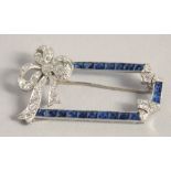 A GOOD PLATINUM DIAMOND AND SAPPHIRE DECO BOW BROOCH.