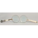 TWO MAGNIFYING GLASSES with mother of pearl handles.