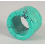 A TURQUOISE ARCHER'S RING.