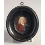 AN OVAL PORTRAIT MINIATURE OF JOHN CHANDLER, 18TH CENTURY. 2ins x 1.5ins in a turned pearwood frame.