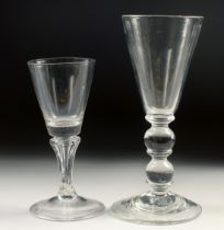 A HEAVY GLASS WINE GLASS with double knop stem and a small Dutch glass (2). 5.25ins high.