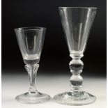 A HEAVY GLASS WINE GLASS with double knop stem and a small Dutch glass (2). 5.25ins high.