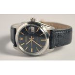 A GENTLEMAN'S ROLEX OYSTER DATE WRISTWATCH with black dial and leather strap.