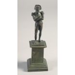 A SMALL BRONZE FIGURE OF NAPOLEON on a pedestal. 4.25ins high.