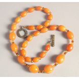 A BUTTERSCOTCH AMBER BEAD NECKLACE, twenty nine beads. Weight: 31gms, 20ins long.