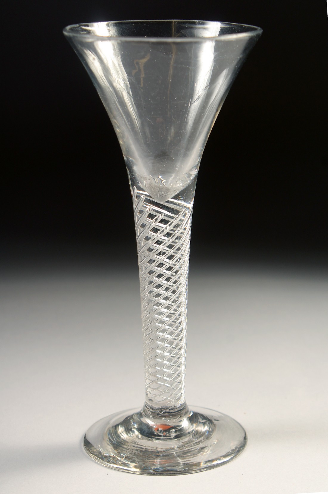 AN 18TH CENTURY TAPERING WINE GLASS with air twist stem. 6ins high. - Image 2 of 4