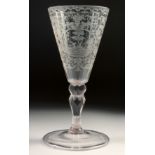 AN 18TH - 19TH CENTURY GERMAN GLASS with facet stem, the bowl engraved with a deer hunt. 7.25ins