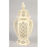 A LATE 19TH CENTURY LEEDS CREAMWARE VASE AND COVER, the body having alternating pierced panels.