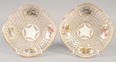 LATE 19TH CENTURY BERLIN PAIR OF PIERCED BASKETS each painted with four panels of birds, sceptre