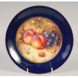 A ROYAL WORCESTER BLUE GROUND PLATE painted with plums and grapes by R Sebright, signed date mark