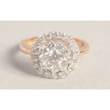 A SUPERB 18CT GOLD ROUND DIAMOND RING.