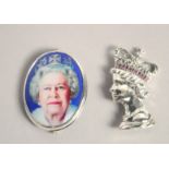 TWO SILVER QUEEN ELIZABETH II BROOCHES.