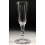 AN 18TH CENTURY DUTCH WINE GLASS with facet stem and plain bowl. 6.75ins high.