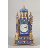 A BLUE CLOISONNE ENAMEL CLOCK with domed top and four pillars.
