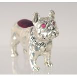 A SILVER PLATED BULL DOG PIN CUSHION. 2.5ins long.