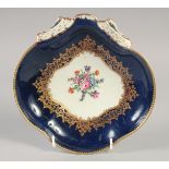 AN 18TH CENTURY WORCESTER WET BLUE SHELL SHAPED DISH painted with flowers under and elaborate gilt