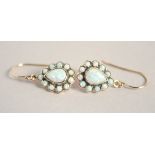 A PAIR OF 9CT GOLD PEAR SHAPED OPAL EARRINGS.