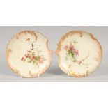 A ROYAL WORCESTER TWO BLUSH SHELL SHAPED PLATES painted in the manner of Edward Raby date 1902 &