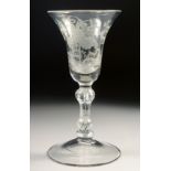 AN 18TH CENTURY WINE GLASS with inverted bell bowl, engraved with vines. 6ins high.
