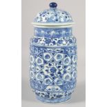 A CHINESE BLUE AND WHITE PORCELAIN CYLINDRICAL JAR AND COVER, decorated with various floral