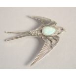 A SILVER OPAL SET SWALLOW BROOCH.