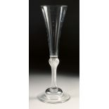 AN 18TH CENTURY TALL PLAIN ALE GLASS with air twist stem. 7.75ins high.