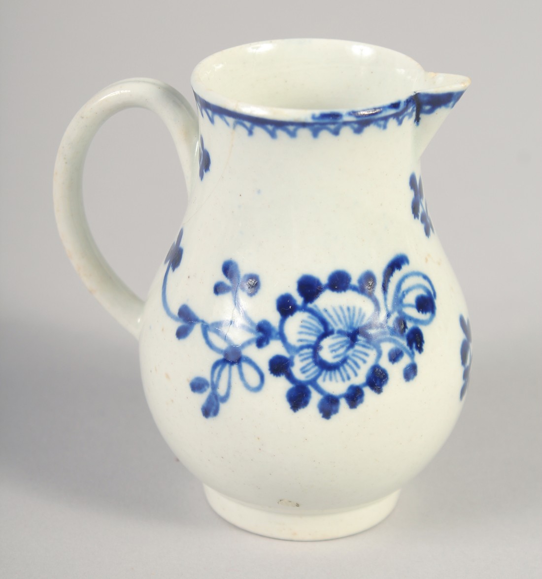 AN 18TH CENTURY LIVERPOOL JUG painted in underglaze blue with flowers with external line and loop - Image 3 of 6