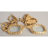 A PAIR OF GILT METAL CHANEL LORGNETTES.