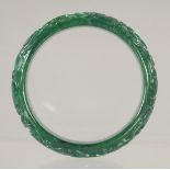 A CARVED JADE BANGLE. 2.75ins.