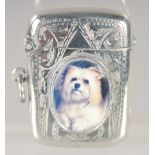 AN EDWARD VII SILVER VESTA CASE with an oval enamel of a Scottie dog. 1.5ins x.75ins Birmingham