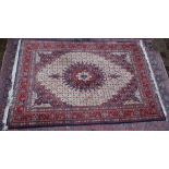 A GOOD PERSIAN CARPET, cream ground with all over floral decoration. 9'6" x 6'8".