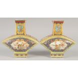 A PAIR OF CHINESE PORCELAIN FAN SHAPED VASE. 8.5ins high.