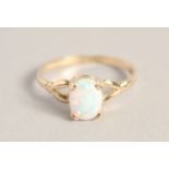 A 9CT GOLD OPAL RING.