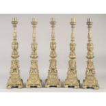 A GOOD SET OF FOUR 18TH CENTURY VENETIAN GILT BRONZE ALTER STYLE CANDLESTICKS with a cylindrical