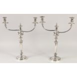 A GOOD PAIR OF MATTHEW BOLTON SHEFFIELD PLATE THREE LIGHT CANDELABRAS, circular bases, tapering