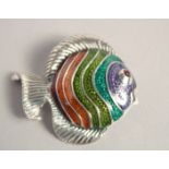 A SILVER ENAMEL ANGLE FISH BROOCH with ruby eyes.