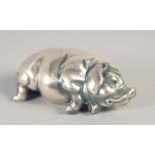 A RUSSIAN SILVER SLEEPING PIG. Marks: Head 84, Eagle. Faberge I. P. 2.75ins long, 43gms.