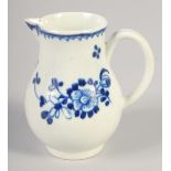 AN 18TH CENTURY LIVERPOOL JUG painted in underglaze blue with flowers with external line and loop