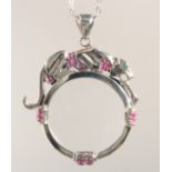 A SILVER ART DECO STYLE PANTHER RUBY SET SPY GLASS AND CHAIN.